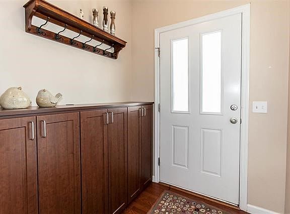 Foyer has cabinetry perfect for backpacks.