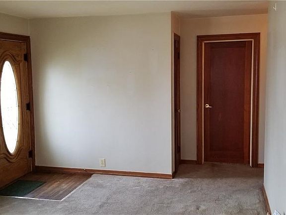 Living room with upgraded entry door