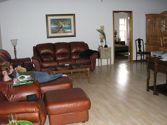 Living room from front entrance. Notice the laminate flooring.
