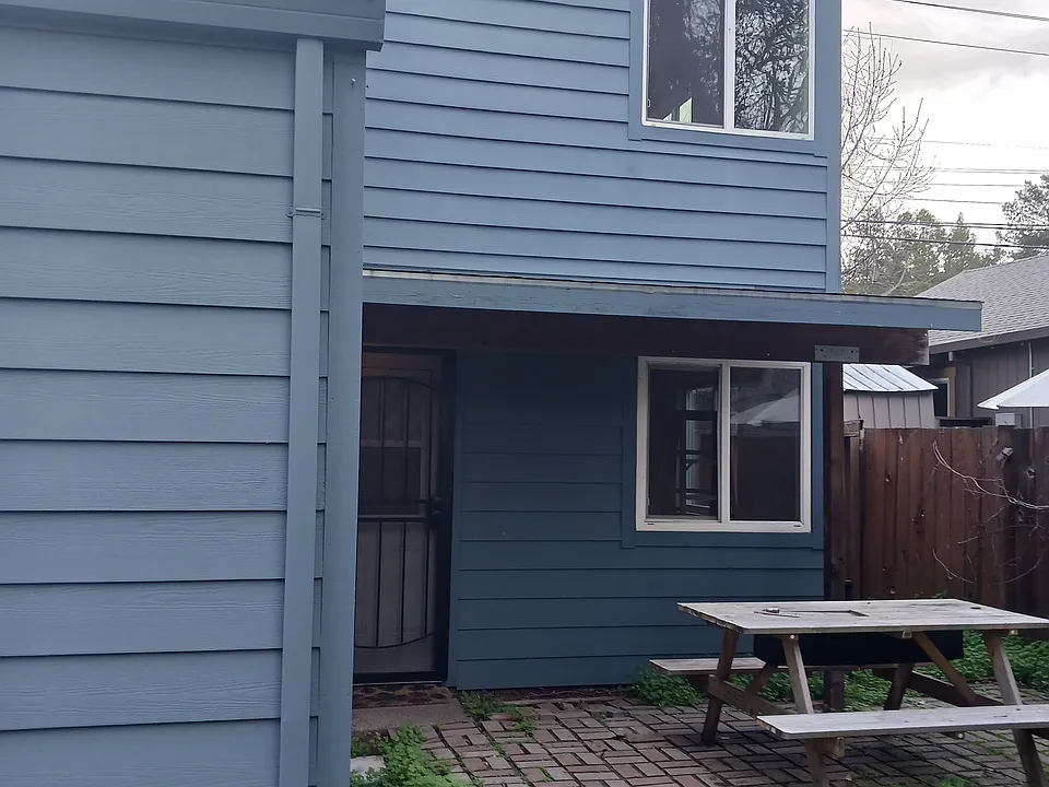 Back patio area, partial view of yard