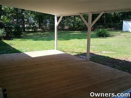 View of covered deck and backyard