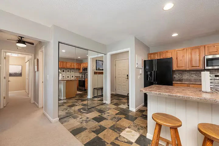Foyer with mirrored closet/pantry