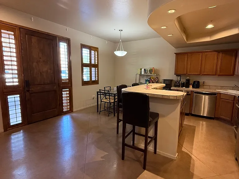 Kitchen and eating area looking at the front door