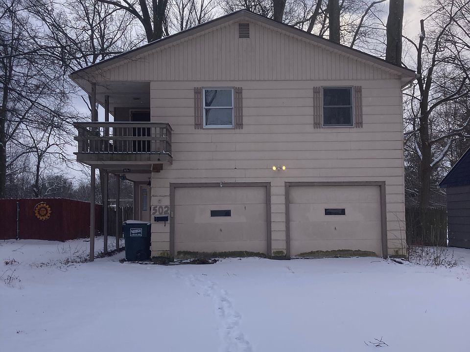 Front of house showing balcony and double garage.
