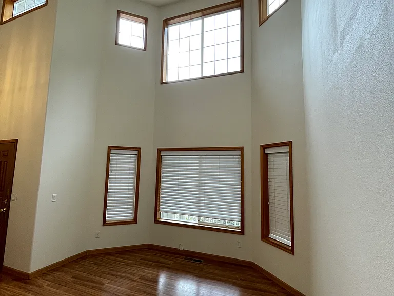 Entryway with High Ceilings and Formal Living Room