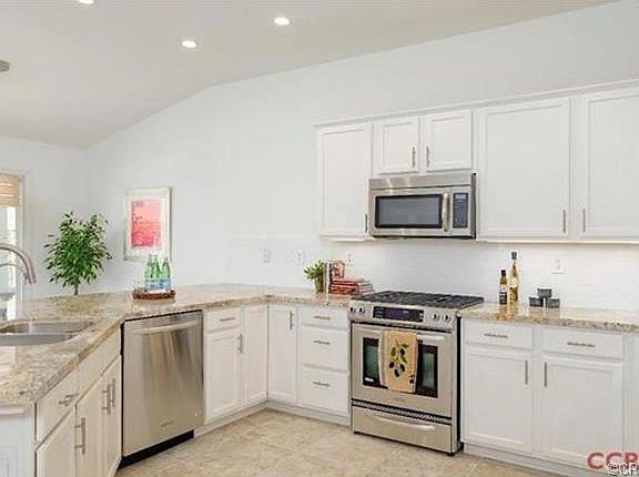 Custom chef's kitchen with new Kitchen Aid stainless steel appli