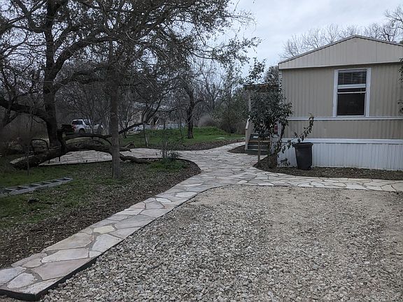 double driveway, sidewalks around all sides