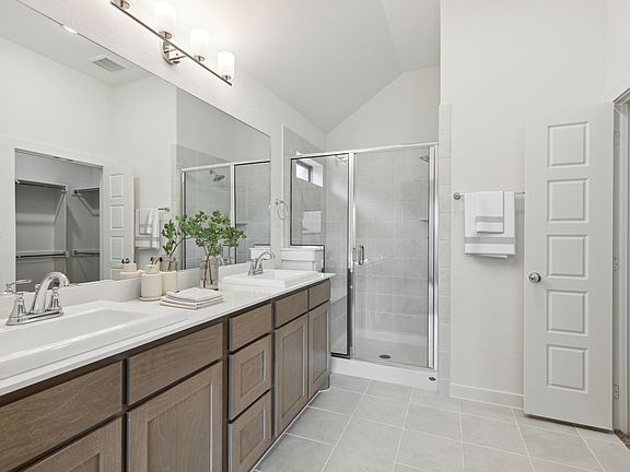 Primary Bathroom in the Jade home plan by Trophy Signature Homes - REPRESENTATIVE PHOTO