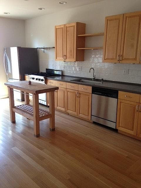 Kitchen opens to private deck and yard
