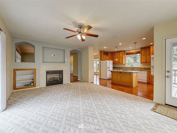 The family room enjoys the two-sided propane fireplace with a niche above to mount a TV or artwork.  