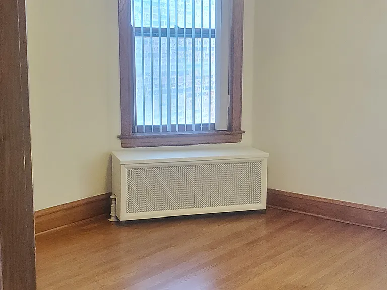 Dining-room: High, oak beamed ceiling, antique ceiling light, covered radiator,