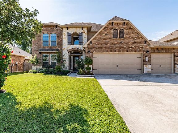 Beautiful view of the front of the home from the street - Spacious Three Car Garage!