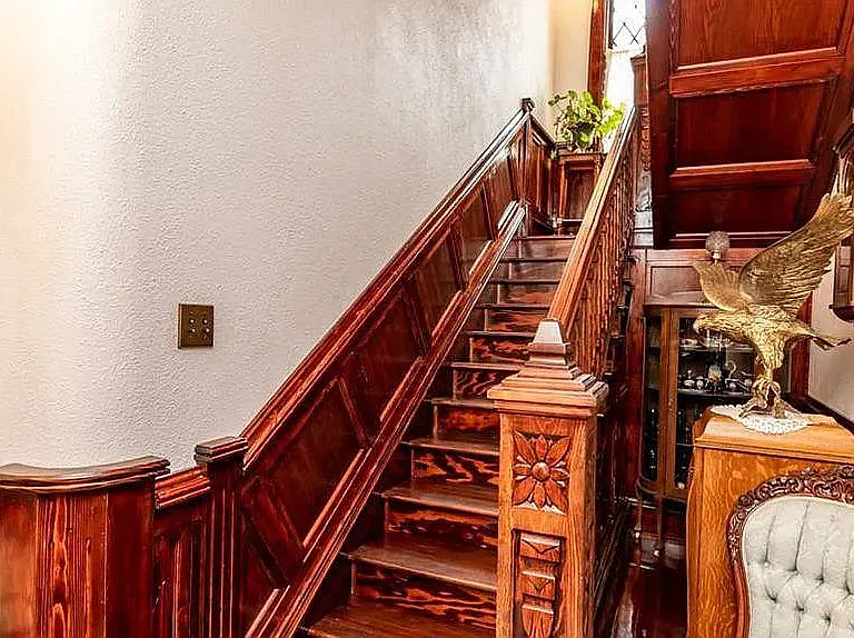 Historic Natural Wood throughout the Mansion along with carved wood Staircase.