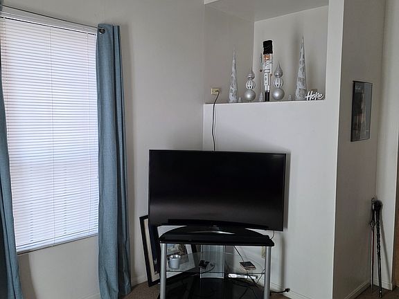 Living Room TV area with built-in display shelf.