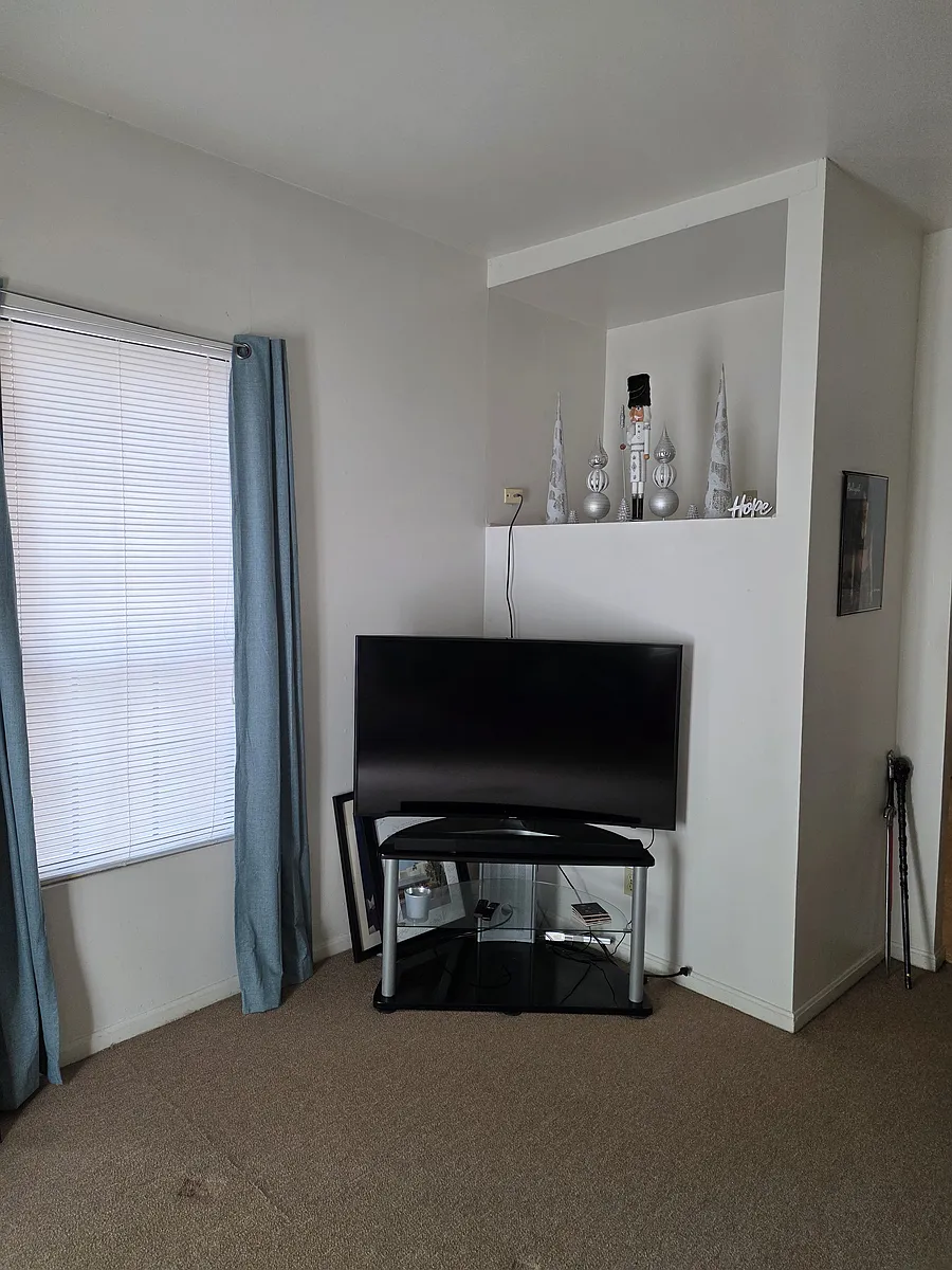 Living Room TV area with built-in display shelf. - 9 W Hollister St #1