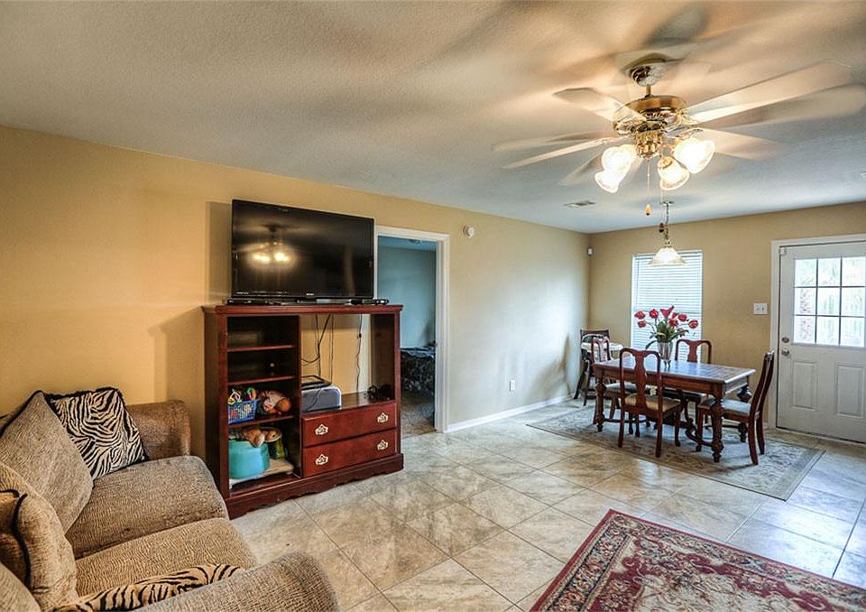 Great neutral colors, tile floor and open plan