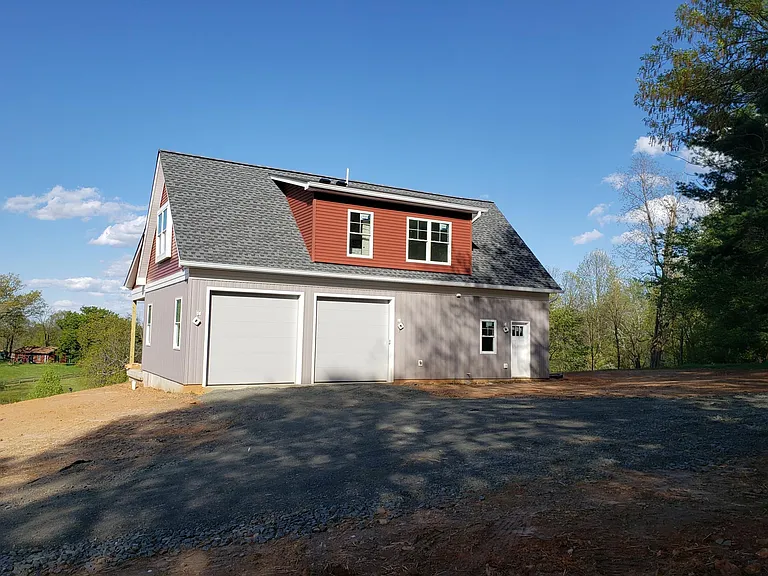 2 bay garage. 9 ft doors, will fit a lifted truck or truck with a rack on top,
