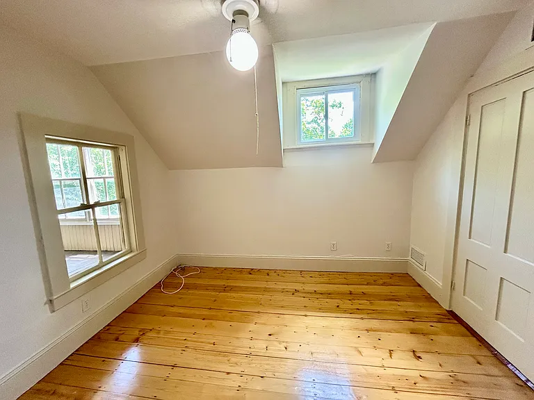 Bedroom or Living Room with Beautifully redone wood flooring. Your preference.