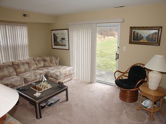 Spacious livingroom with sliders to patio.