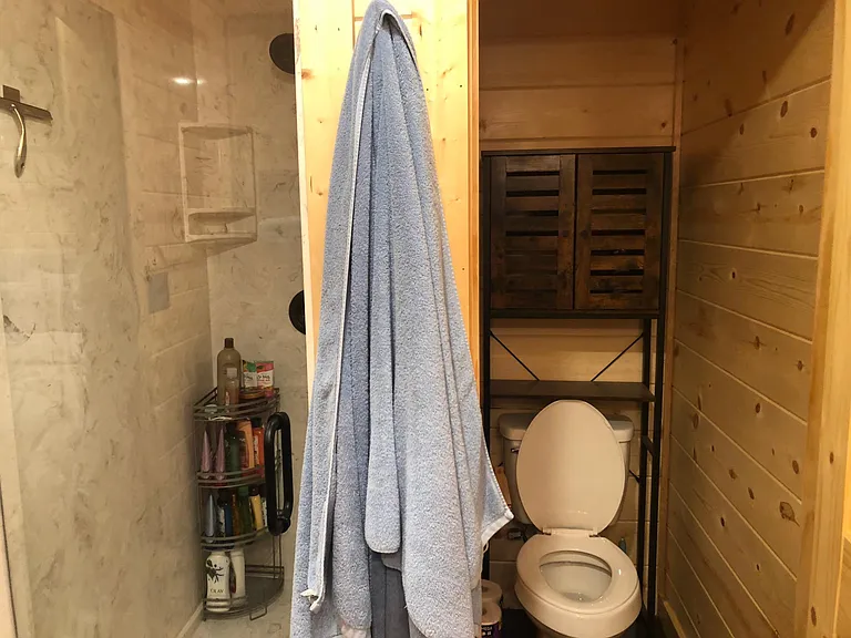 Large walk-in marble shower, and private water closet.