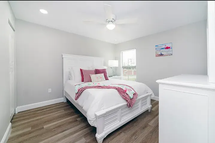 Additional queen bedroom with fun accents and comfortable bedding, ready for a good night's sleep.