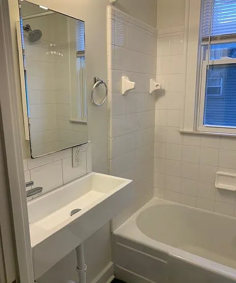 Bathroom with tub and shower combination