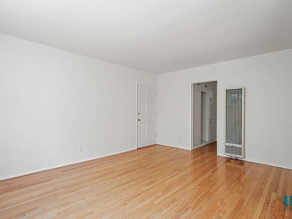 Front Entry and Living Room with Vinyl Flooring