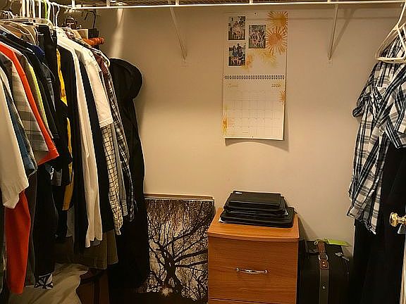 Walk-in closet in bedroom.