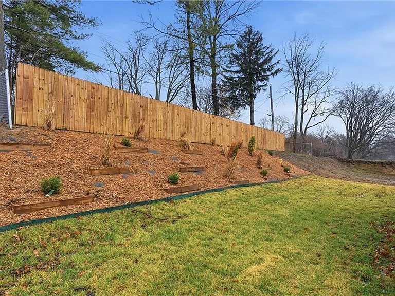 backyard partially fenced