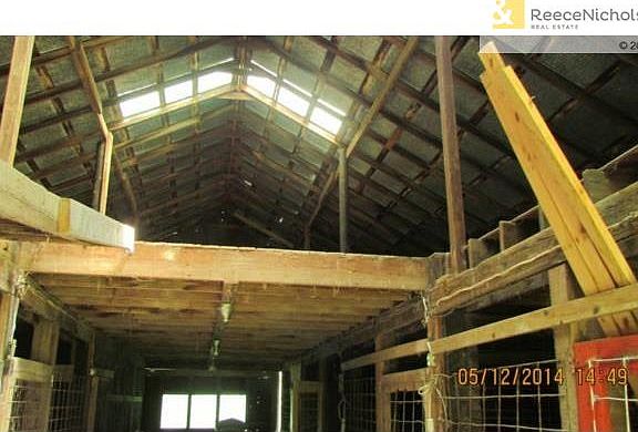 Inside of horse barn - large loft area above