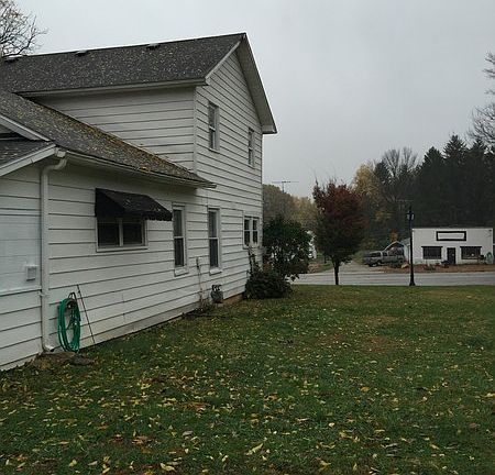 Next to driveway