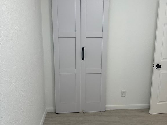 Front bedroom has barn door closet.
