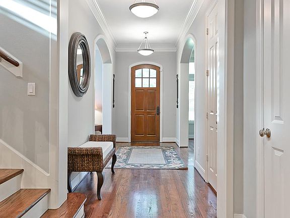 Wide & sweeping foyer with views from the front to the back, a coat closet and guest bath nearby. Fo
