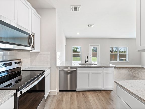 The kitchen of the Rio Grande has gorgeous white wood cabinetry.