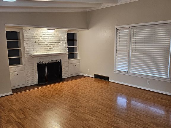 Fresh paint, wood beam ceilings