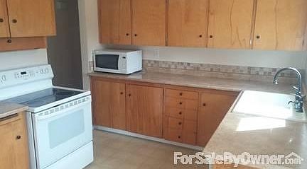 Kitchen
						:
						Lots of cabinets, newer dishwasher, stove, refrigerator/freezer and microwave.