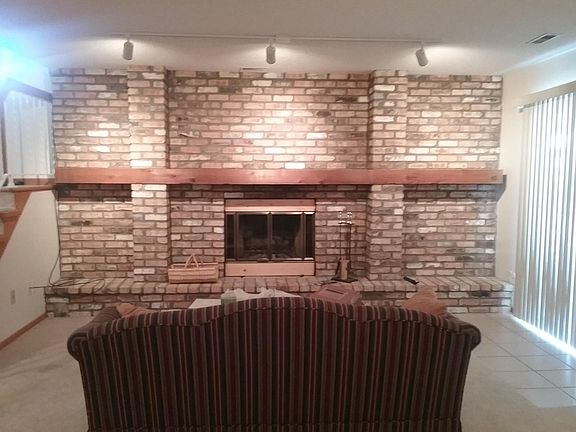 Lower Level Brick Fireplace Wall