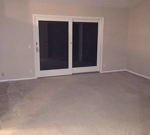 Master bedroom w/ access to backyard