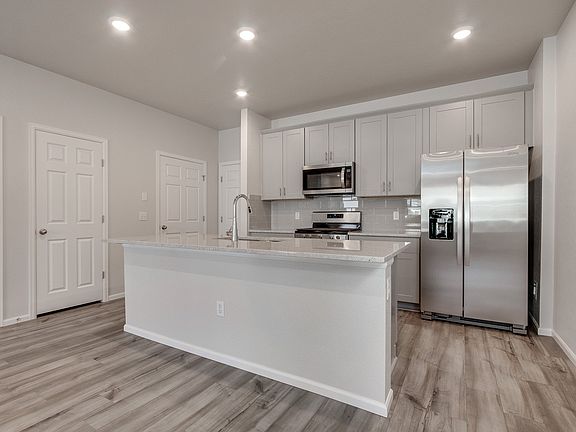 The open-concept kitchen spills into the dining room allowing for an open feel.