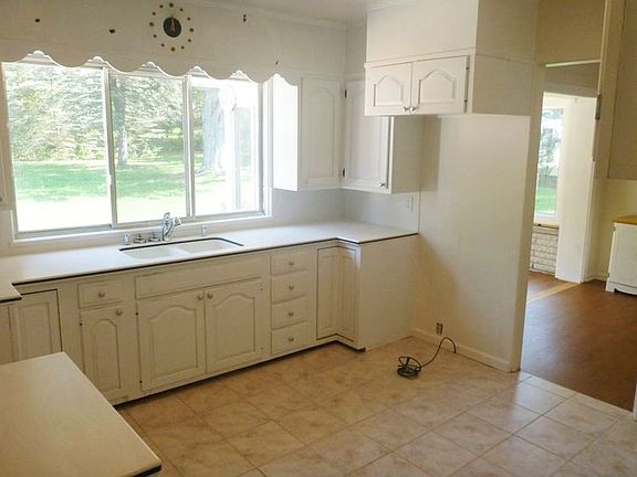 Kitchen overlooks the Patio and Backyard