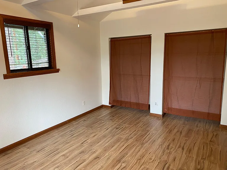 This view of the main bedroom shows how large it is and how beautiful the Hickory flooring is now that we finished our renovation.