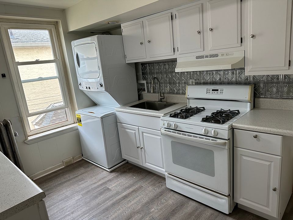 kitchen with stacked washer and dryer