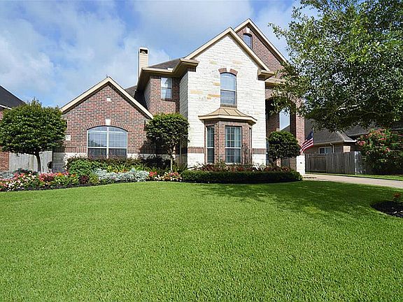 Classic two-story home is the pride of the neighborhood.