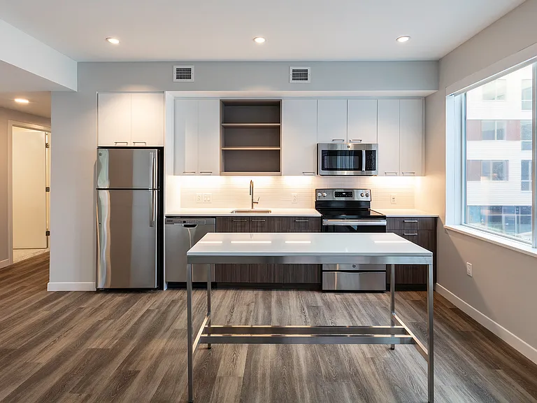 Spacious kitchens provide great natural light, quartz countertops, designer cabinetry, and more.