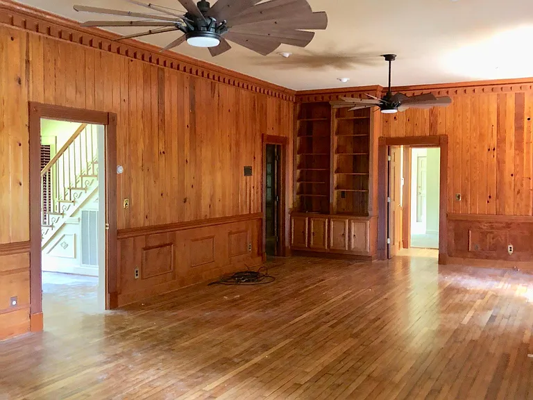 Large Den with built-ins- Beautiful wooden floors. Wood came from the Boys Colony when it was turndown in the 1970's. Refinished and beautiful.