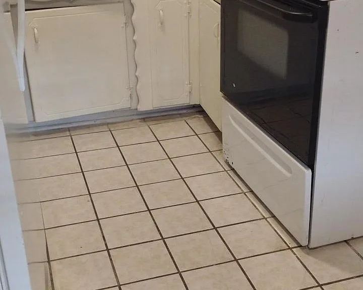 Kitchen with fridge and electric stove