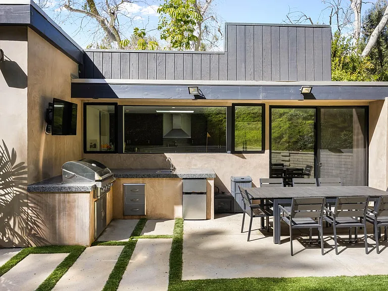 Experience outdoor dining at its finest with the BBQ grill in the outdoor seating area.