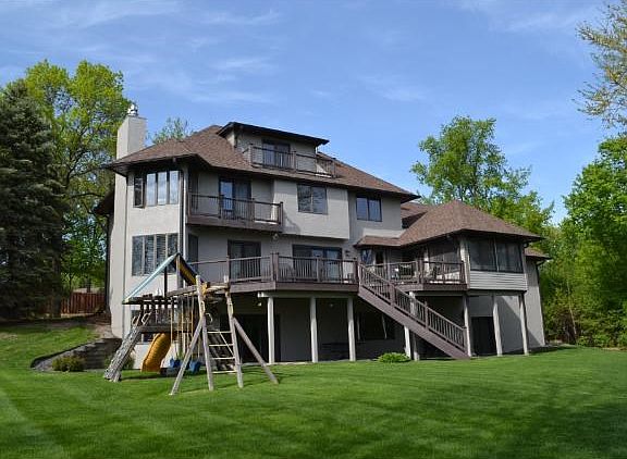 The large 3/4 acre lot has plenty of room to play and includes a sport court. Spacious deck for and three season porch for entertaining. Large stacked garage for lake toys and storage.