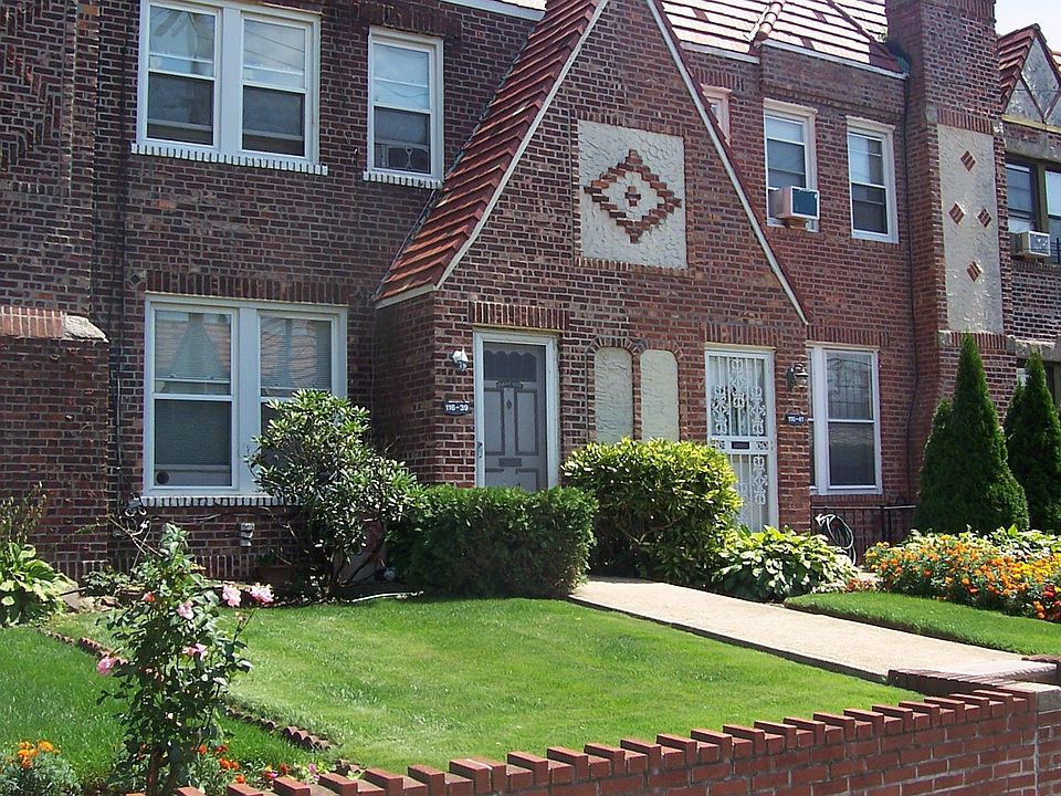ALL BRICK TUDOR IN LOVELY CAMBRIA HEIGHTS, NY