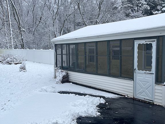 Three seasons room off of garage